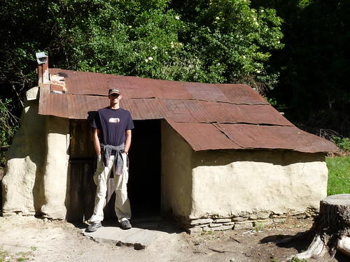 Ed outside restored Chinese hut in old Chinese settlement in Arrowtown