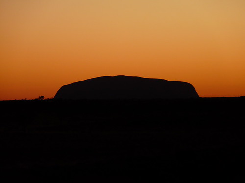Sunrise behind Uluru