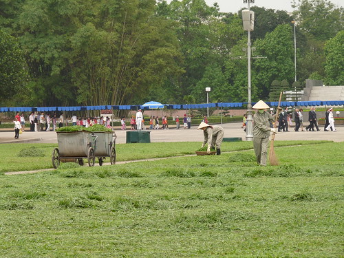 Cutting the grass by hand outside Ho Chi Minh&rsquo;s Mausoleum